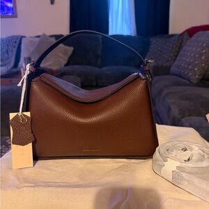 The horse clementine bag in coffee. Like new with tags.